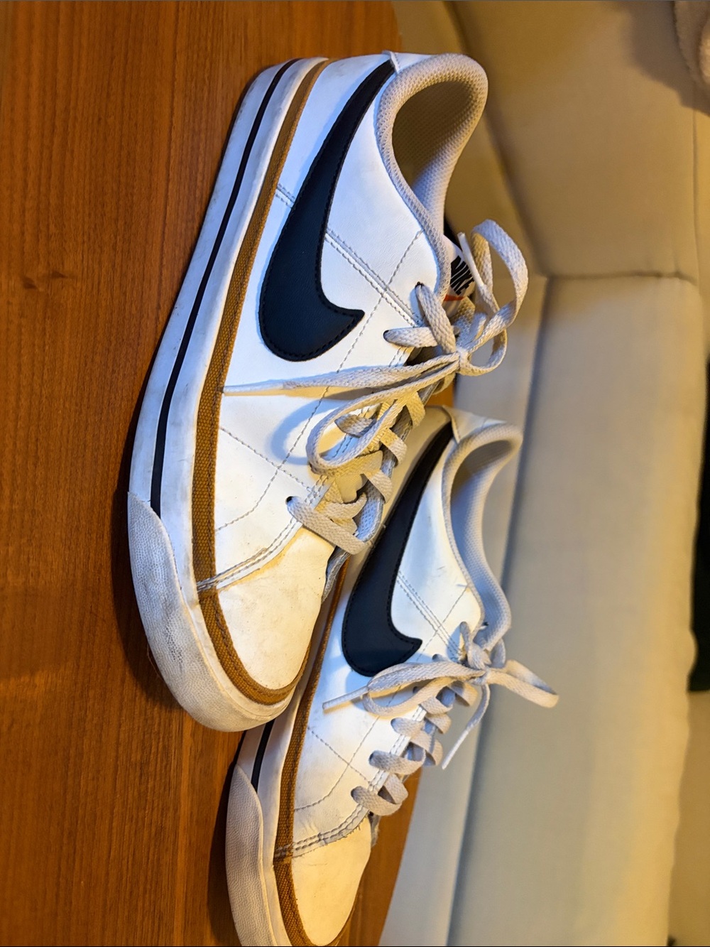 Nike Women's White Sneakers with Black Swoosh and Tan Trim